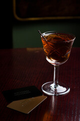 Cognac in fashion glass with cards