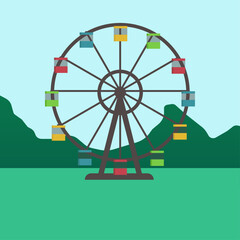 Ferris wheel with mountains on background - summer mood