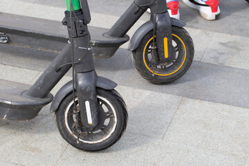 Scooter rental.Parking of electric scooters in the city.Close-up.