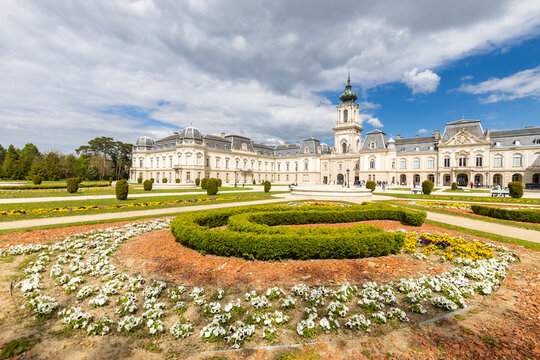 Keszthely, Beautiful Baroque Palace of the Festetics family (Helikon Palace Museum) Historical architecture in Hungary Panorama blue sky with picturesque clouds, spring gardens. Keszthely 30.04.2023