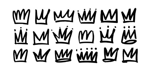 Set of brush drawn crowns or diadems icons. Doodle diadems collection. Queen royal tiaras vector elements isolated on white. Hand drawn king crown charcoal sketches.