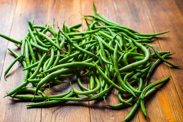 Bean harvest collected in the garden. Plantation work. Autumn harvest and healthy organic food concept close up with selective focus