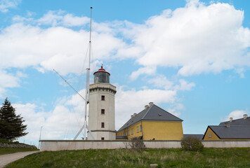 Fototapeta na wymiar Hanstholm lighthouse was built in 1843 and was the first lighthouse on the west coast of Jutland. Hanstholm lighthouse establishment consists of nine buildings