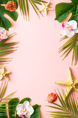 Summer flat lay on pink background. Tropical leaves, palm leaves, flowers and sea shells.