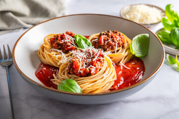 Vegetarian spaghetti Bolognese with Lentils in Tomato Sauce with Parmesan Cheese and Basil leaves. Healthy vegan food concept