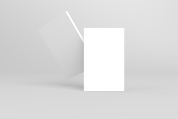 2 softcover book mockups are standing on a gray background, designed with 3D render visual effects that are indistinguishable from reality. A mockup, with flashy white covers resembling a real book.
