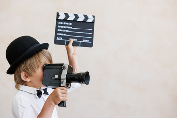 Child pretend to be a director - obrazy, fototapety, plakaty