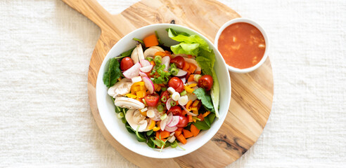 Banner with fresh salad bowl and homemade dressing