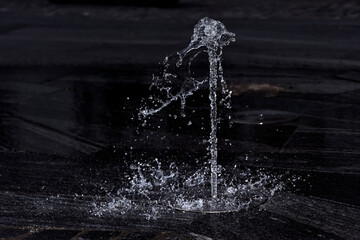 Clear water splash on black background - 600881650