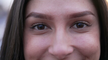 Portrait of a happy Middle Eastern young woman eyes looking at camera smiling