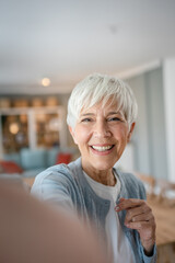 Close up portrait of one senior woman with short hair happy smile