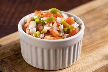 Vinaigrette in ramekin on the table.