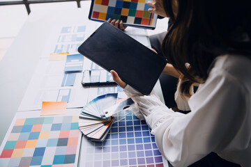Close up ux developer and ui designer brainstorming about mobile app interface wireframe design on...