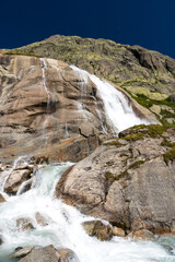 small waterfall of a mountain creek at Grimselpass