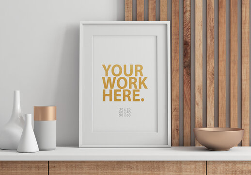 Vertical Poster Art Frame Mockup with passepartout  on commode