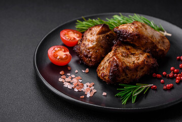 Delicious grilled meat in the form of a kebab with spices and herbs