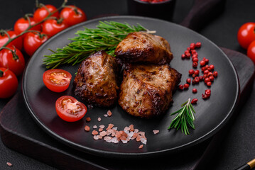 Delicious grilled meat in the form of a kebab with spices and herbs