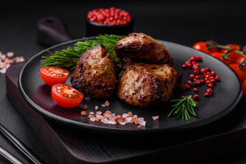 Delicious grilled meat in the form of a kebab with spices and herbs