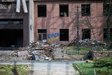 A destroyed building in the city of Mykolaiv due to a hit by a Russian rocket. The writing is on the wall we will live