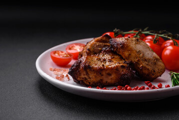 Delicious grilled meat in the form of a kebab with spices and herbs