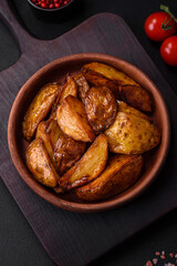 Delicious grilled potato slices with garlic, spices and herbs