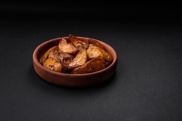 Delicious grilled potato slices with garlic, spices and herbs