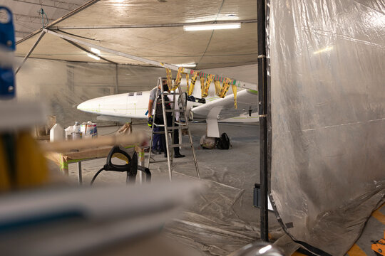 Airplane waiting for its paint to dry in White Tent