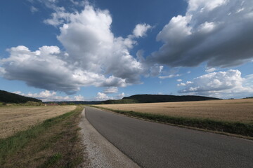 Fototapeta na wymiar Skies, shot with a wide-angle lens. Perspectives are distorted, and skies look wider and more dynamic. Shot from the French coast and its countryside.