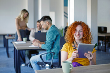 Young Woman Working on Computer in a Modern Bright Office.