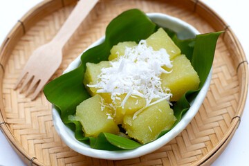 Steamed tapioca cake or cassava cake with grated coconut