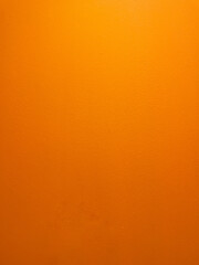 orange colored background, bright abstract texture of painted cement wall 