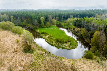 Fototapeta na wymiar Small river Lyna flowing in Warmia
