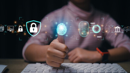 Women use fingerprint identification to access personal financial data. for E-KYC electronic know...