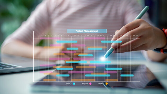 Analyst working with computer in management system to make report with KPI and metrics connected to database. corporate strategy for finance, operations, sales, marketing.Project management concept.