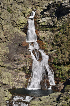 Waterfall on a rocky mountain slope