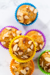Lemon poppy seed muffins garnished with almond slivers