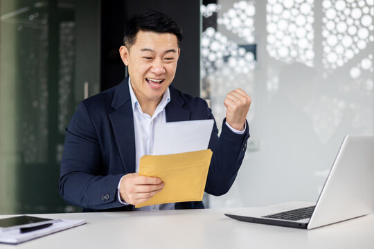 Successful investor businessman received a notification letter from the bank with good news, businessman opens the envelope reads and rejoices at the news, man is satisfied with achievements.