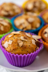 Lemon poppy seed muffins garnished with almond slivers