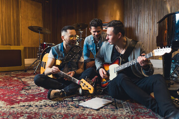 Young musicians practising the song in rehearsal room. High quality photo