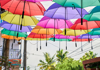 Fototapeta na wymiar Colorful umbrellas in the street in Guatapé Colombia 