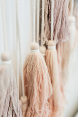 tassles hanging on a wall