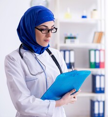Arab female doctor working in the clinic
