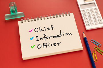 There is notebook with the word Chief Informationl Officer.It is as an eye-catching image.