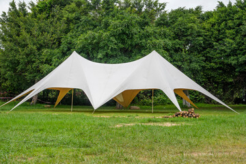 Camping tents on green grass in the park