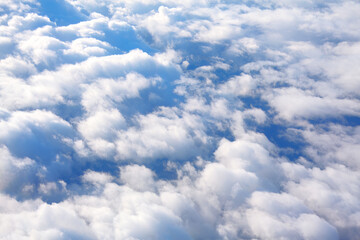 Flying in fluffy white clouds . Angelic white clouds