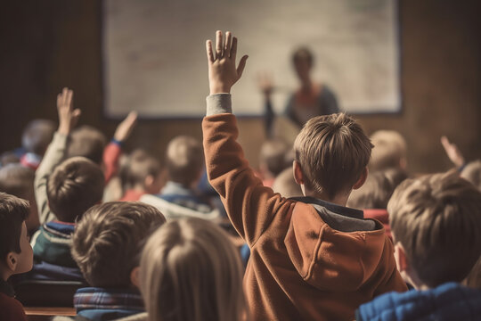 A Caucasian boy student raising his hand to answer a question or asking a question in a school, AI Generated