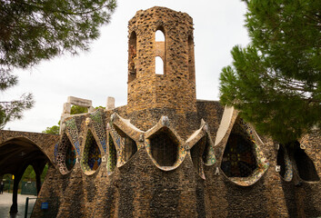 Exterior view of guell crypt, a masterpiece gaudi architecture located at catalunya outside town