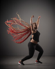 young African American woman black hip hop dancer with long braids