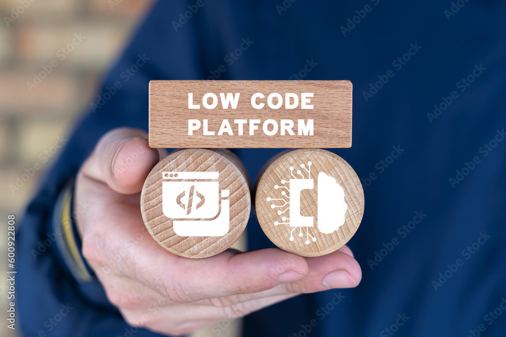 Poster man holding wooden cubes with icons and inscription: low code platform. concept of low code software