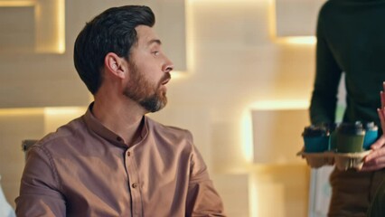 Fatigued man manager waiting day ending closeup. Worker bringing coffee to break